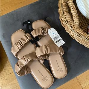 Size 8 brand new memory foam sandals with price tag.